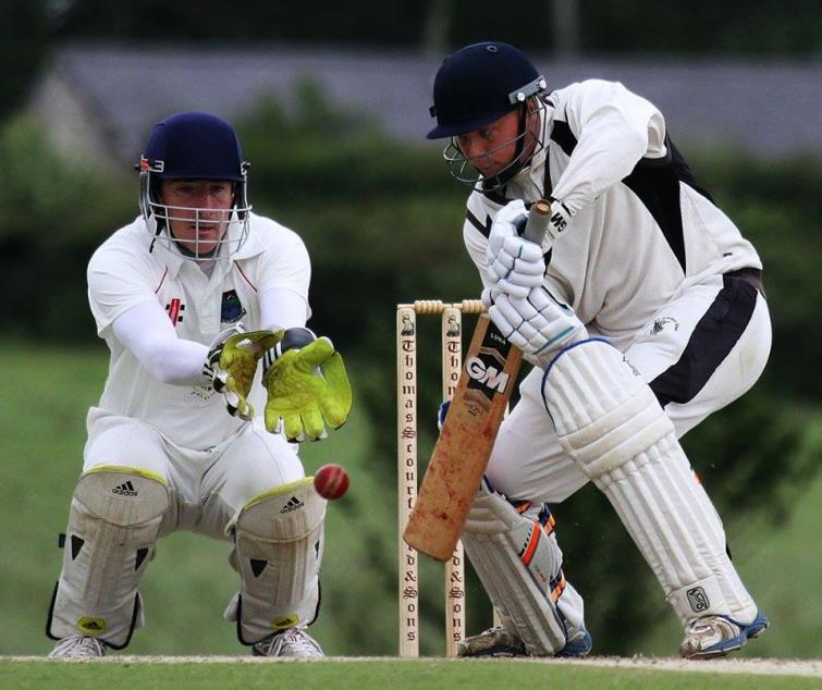 Dylan Blain  tries to stump Ashley Sutton