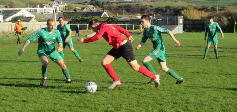 Action from the Senior Cup quarter final tie between Solva versus Carew