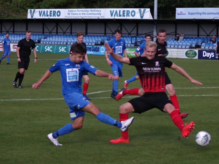 ​Ben Fawcett has a low shot at goal