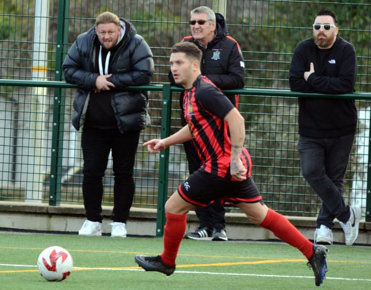 Two-goal cup hero - Scott Ferney pushes forward for Tenby who won to reach the semis. Picture Gordon Thomas