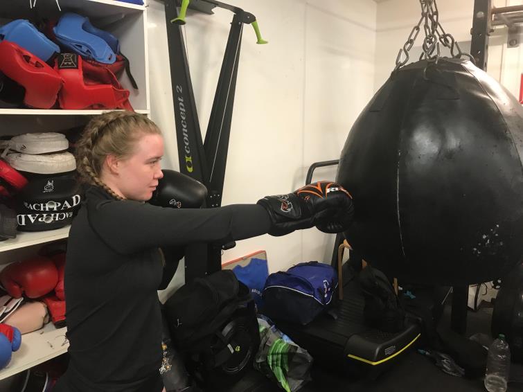 Ffion throws a straight right in the gym