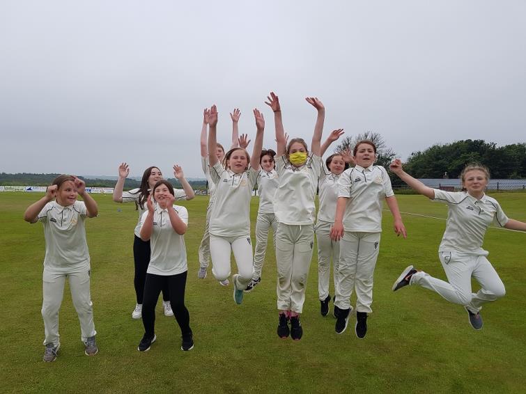 Tavernspite Girls jump for joy after their performances.