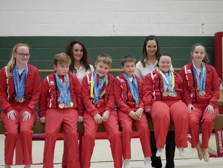 Katie Bowie-Hallam is deligthed to pose with her medal winning team mates