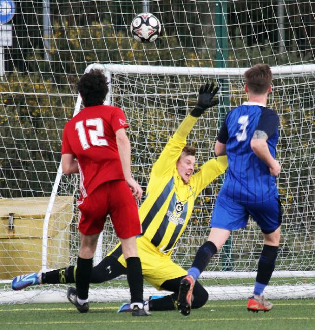 Harry Penniket lashes the ball into the back of the net for Carew