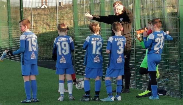 Harry Thomas with his under 11s