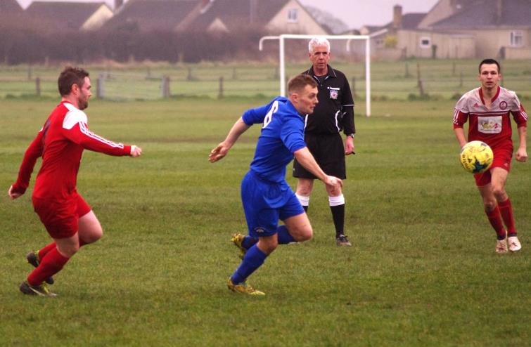 Action from the Racecourse where Merlins Bridge were too strong for Milford United