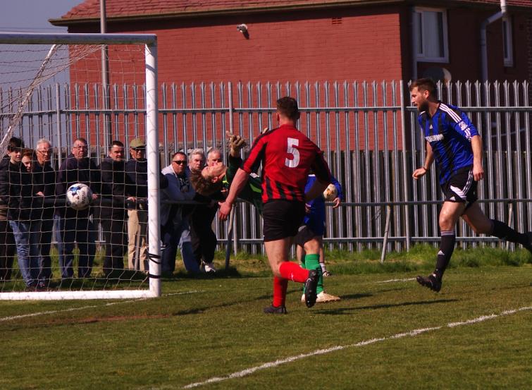 Gareth Fawcett scores with a header for Hakin United who thrashed nine-man Tenby