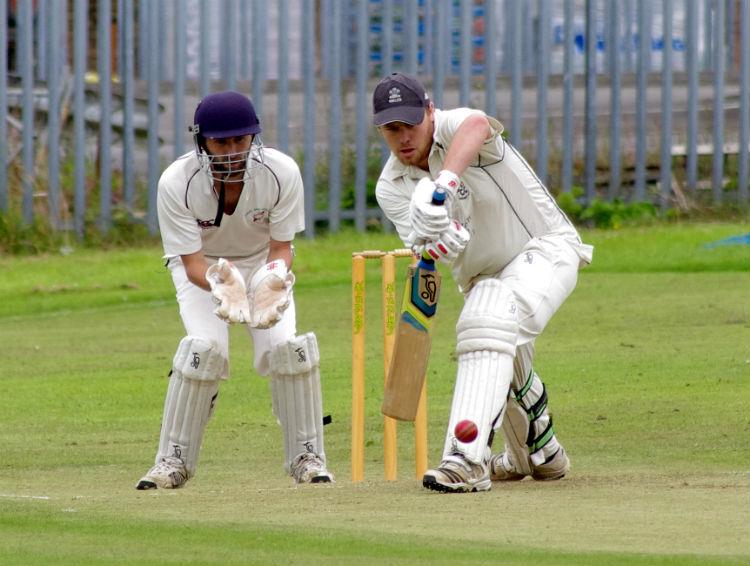 Steve Mills hits a four