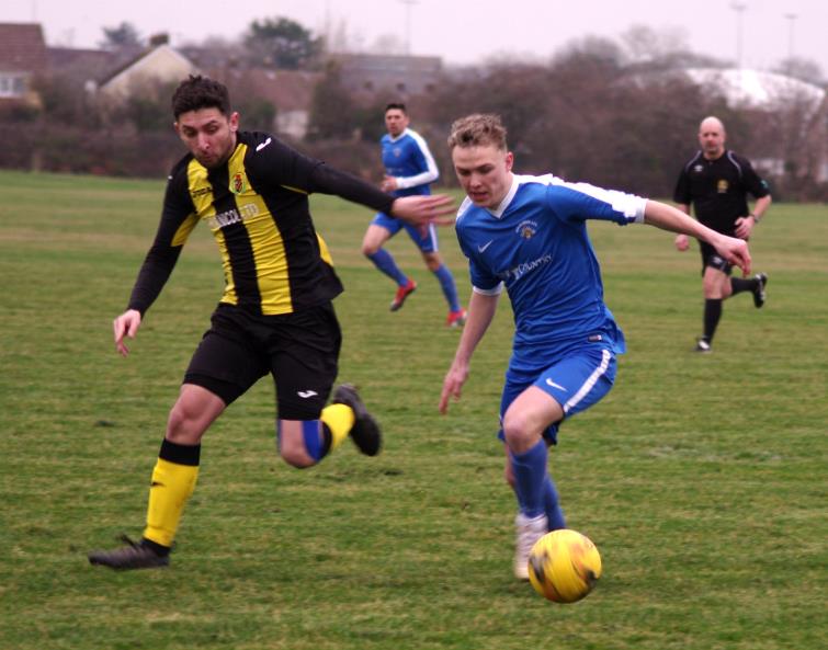 Will Haworth presses forward for Merlins Bridge in their Senior Cup tie against Herbrandston on the Racecourse