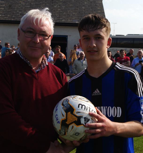 Ben Fawcett receives man of match ball from Chris Tansey of Manderwood