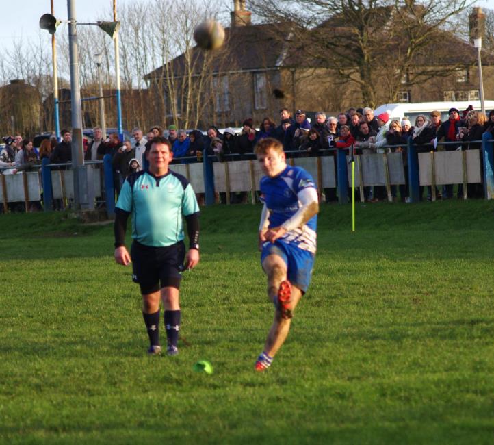 Ollie Hughes kicks a penalty