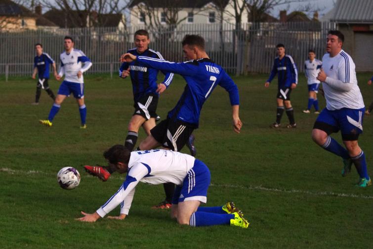 Ben Steele drills in one of his four goals for Hakin United against Angle