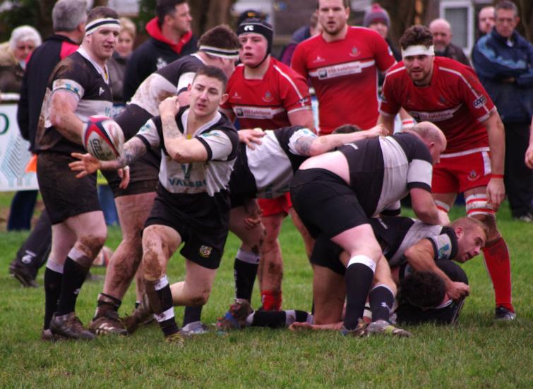 Quins scrum half Jake Griffiths gets his pass away