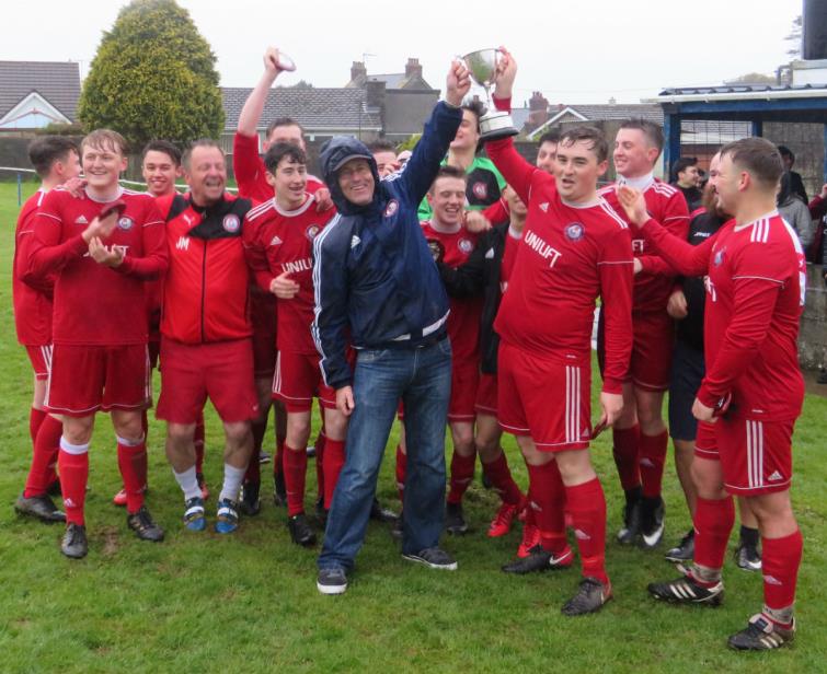 Milford United 3rds raise the cup aloft