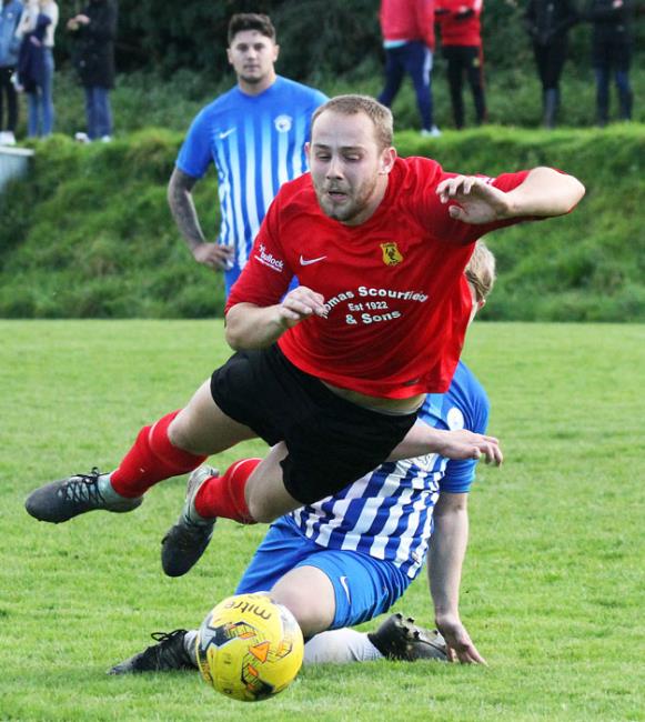 Carew hat-trick hero Jordan Richards takes a tumble against Narberth