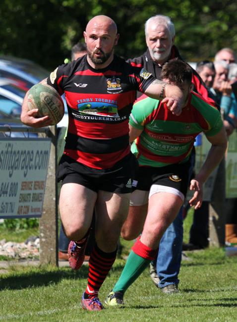 Mark Heyward on the burst for Tenby United