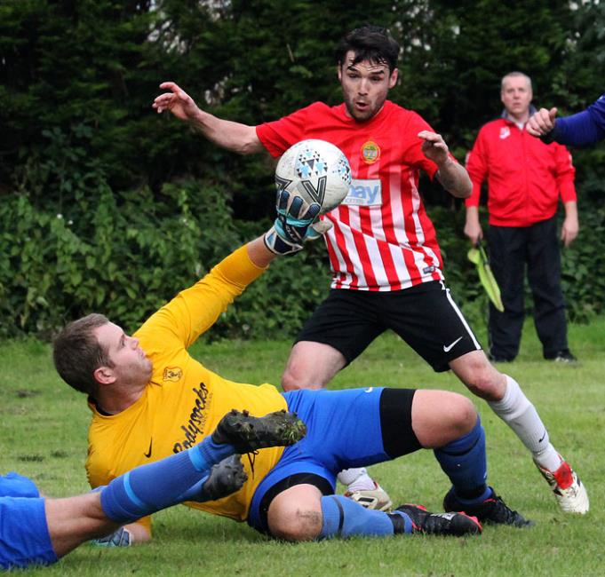 Carew goalkeeper Tom Davies pulls off a brilliant save to deny Sports Chris Milward