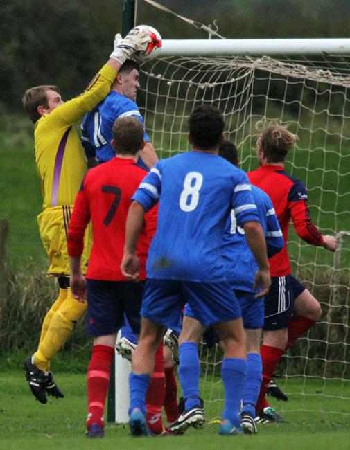 Carew goalkeeper Tom Davies gathers from a corner in his side’s win against the Swifts