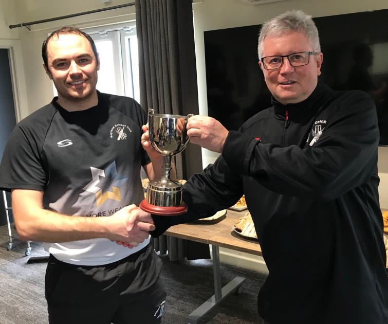 Neyland skipper Sean Hannon receives the trophy from Martin Jones, vice chairman, Pembroke CCC