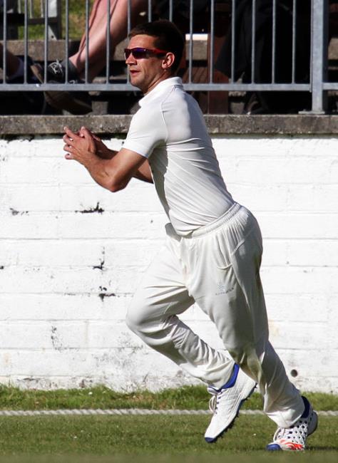 Simon Stanford takes a catch to dismiss a Llechryd batsman