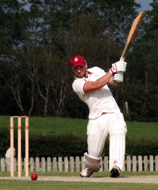 Iwan Izzard strikes the ball to the boundary in Cressellys victory