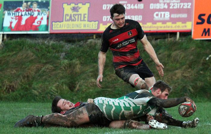 Whitland centre Josh Thomas crashes over for a try