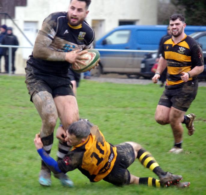 Jack Price is stopped by Matthew Davies