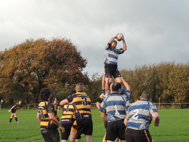 James Lewis wins lineout ball for Llangwm