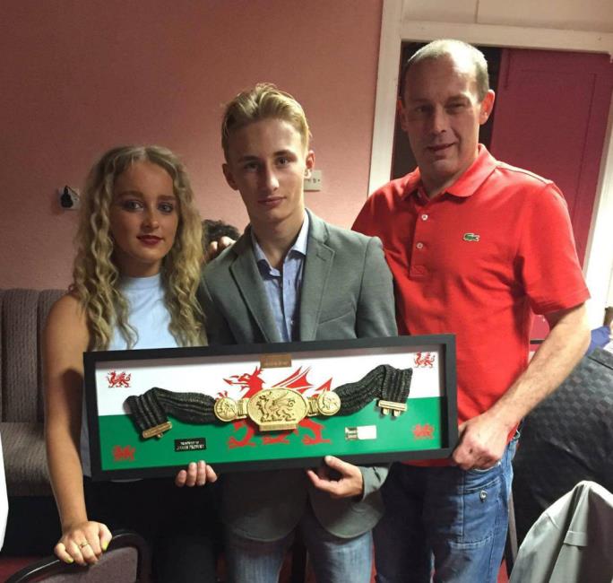 James receives the Howard Winstone award from Howard Winstones son and granddaughter