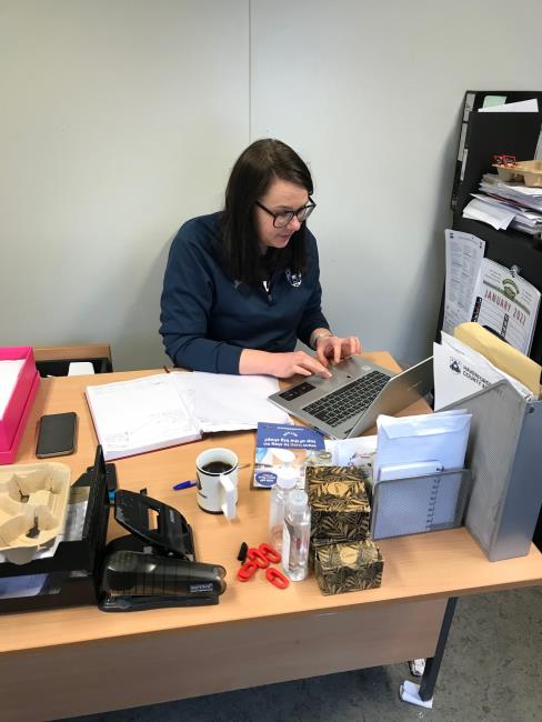 Julie Le-Grice working in office