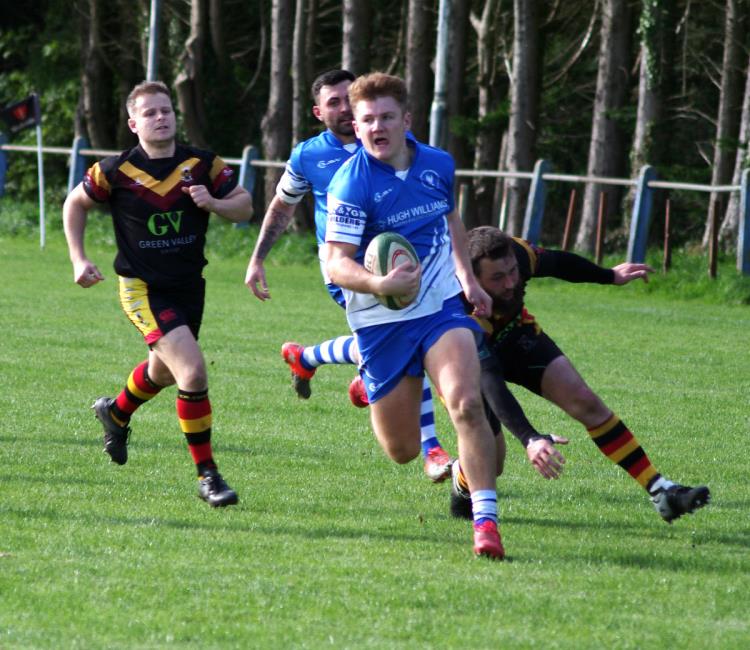 Winger Ollie Hughes canters over for a try