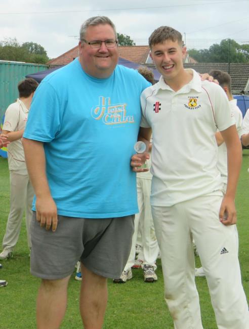 Johnnie Lewis presents man of match trophy to Rhys Grigg