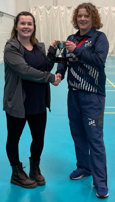 Sam Rossiter receives the trophy from Lauren Arthur