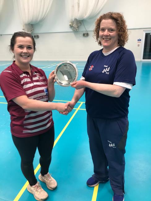 Lauren Davies presents the silverware to Hook captain Sam Rossiter