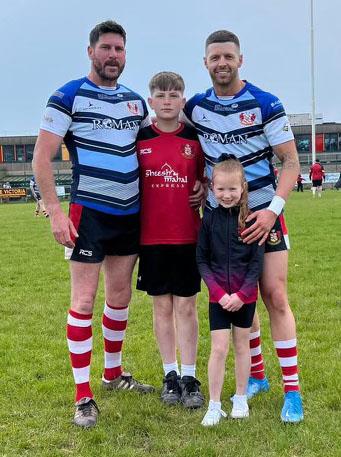 Lee Riley and Jamie Lewis with their children
