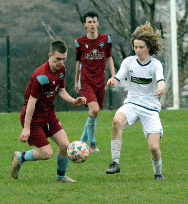 Fishguard goal scorer Iwan Lilley competes for possession