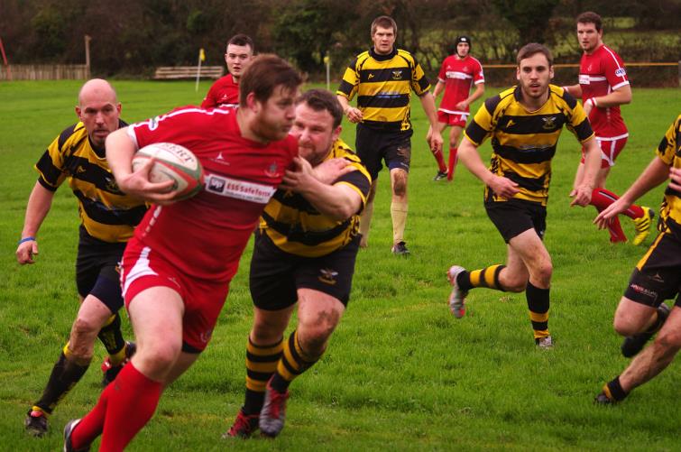 Dom Coleman runs strong for Pembroke against Llangwm