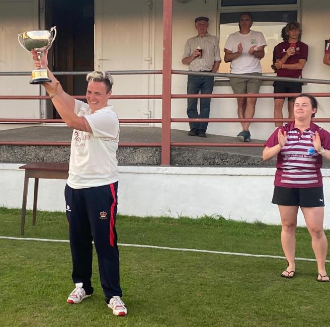 Cresselly skipper Lucy Johnson holds cup aloft