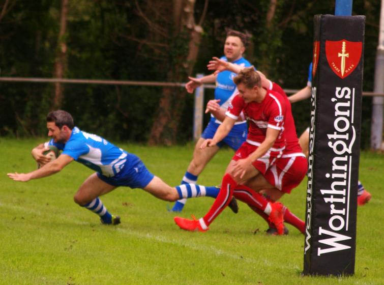 Matthew Davies dives over for a try for Haverfordwest