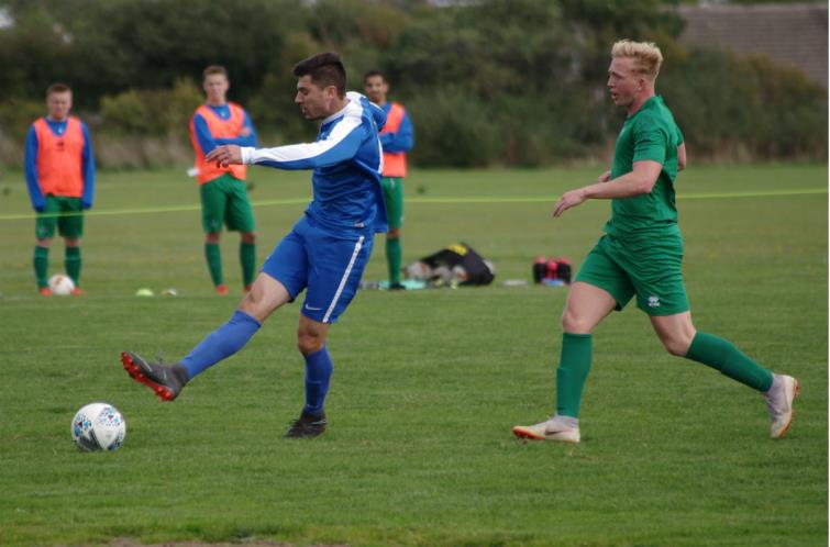 Merlins Bridge player/boss Matthew DIvry has a shot against Swansea University