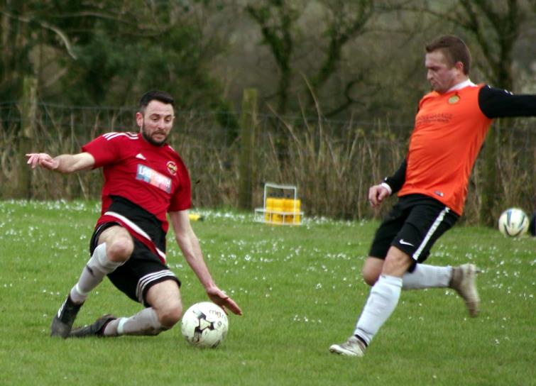 Clarbie player boss Matt Ellis puts in a strong tackle in his sides win against Saundersfoot Sports