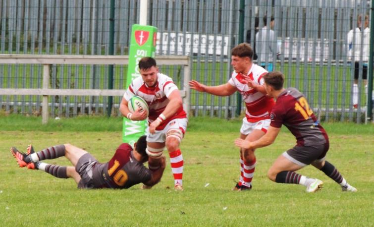 Kyle Hamer breaks a tackle for the Mariners