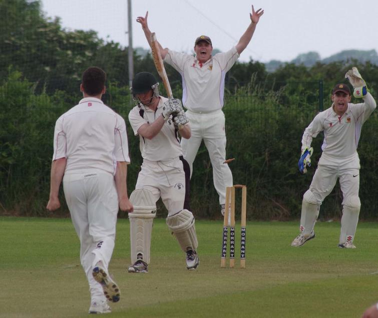 Carew seam bowler Neil Gregory snaps up the wicket of Neylands Andrew Miller