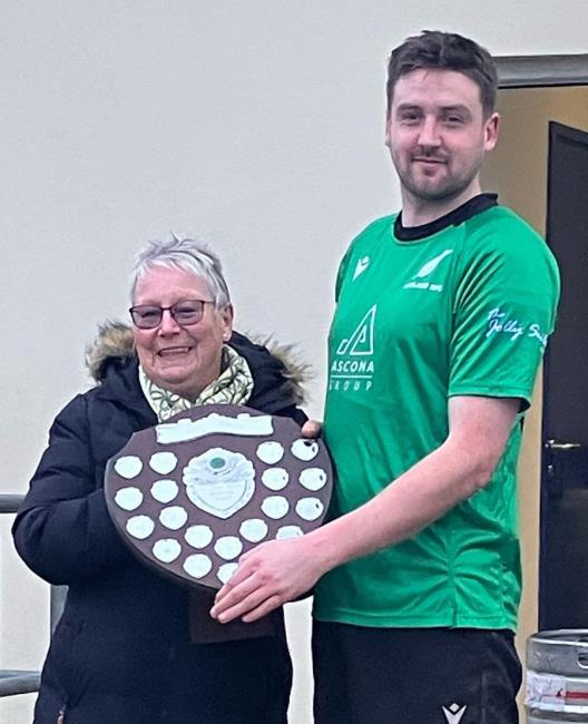 Noreen Hadfield presents the John Preece Shield to Neyland captain George Williams