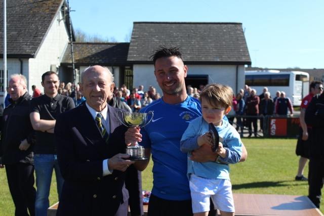 Nathan Thomas celebrates 2017 Senior Cup success with son Cai