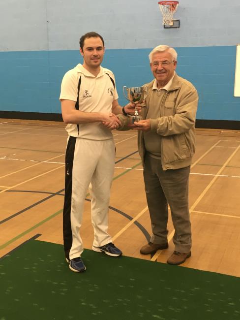 Neyland skipper Sean Hannon recieves the cup