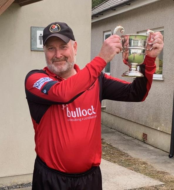 Delighted skipper Scourfield raises the trophy aloft