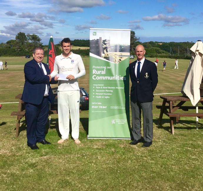 Brian Hawkins of Thomas Carroll hands over a cheque to Nick Cope with Paul Webb in attendance