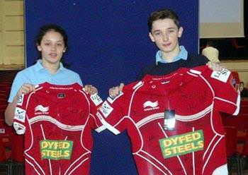 Two school pupils rewarded for consistency