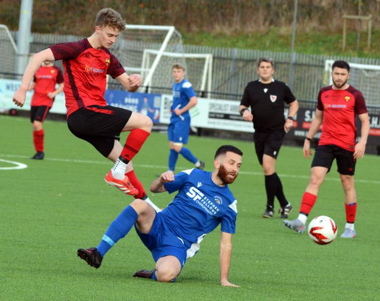 Sam Hurton shot is blocked by Bridge skipper Jordan Thomas. Picture Gordon Thomas